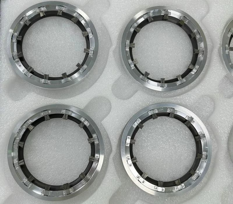 Custom shaft grounding rings with an added sealing layer shown in protective packaging